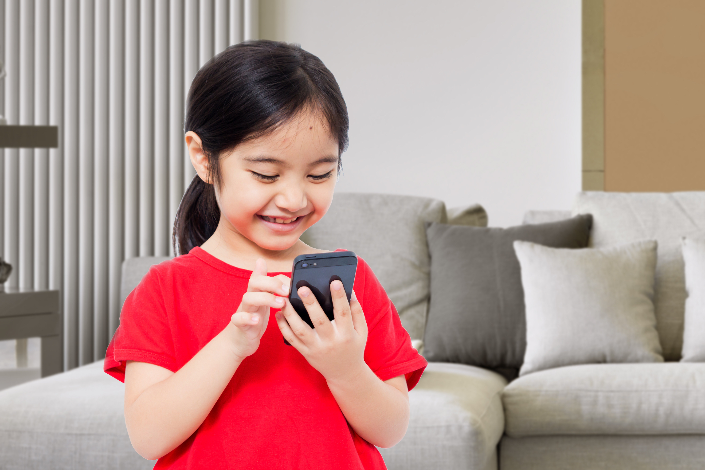 child looking at phone