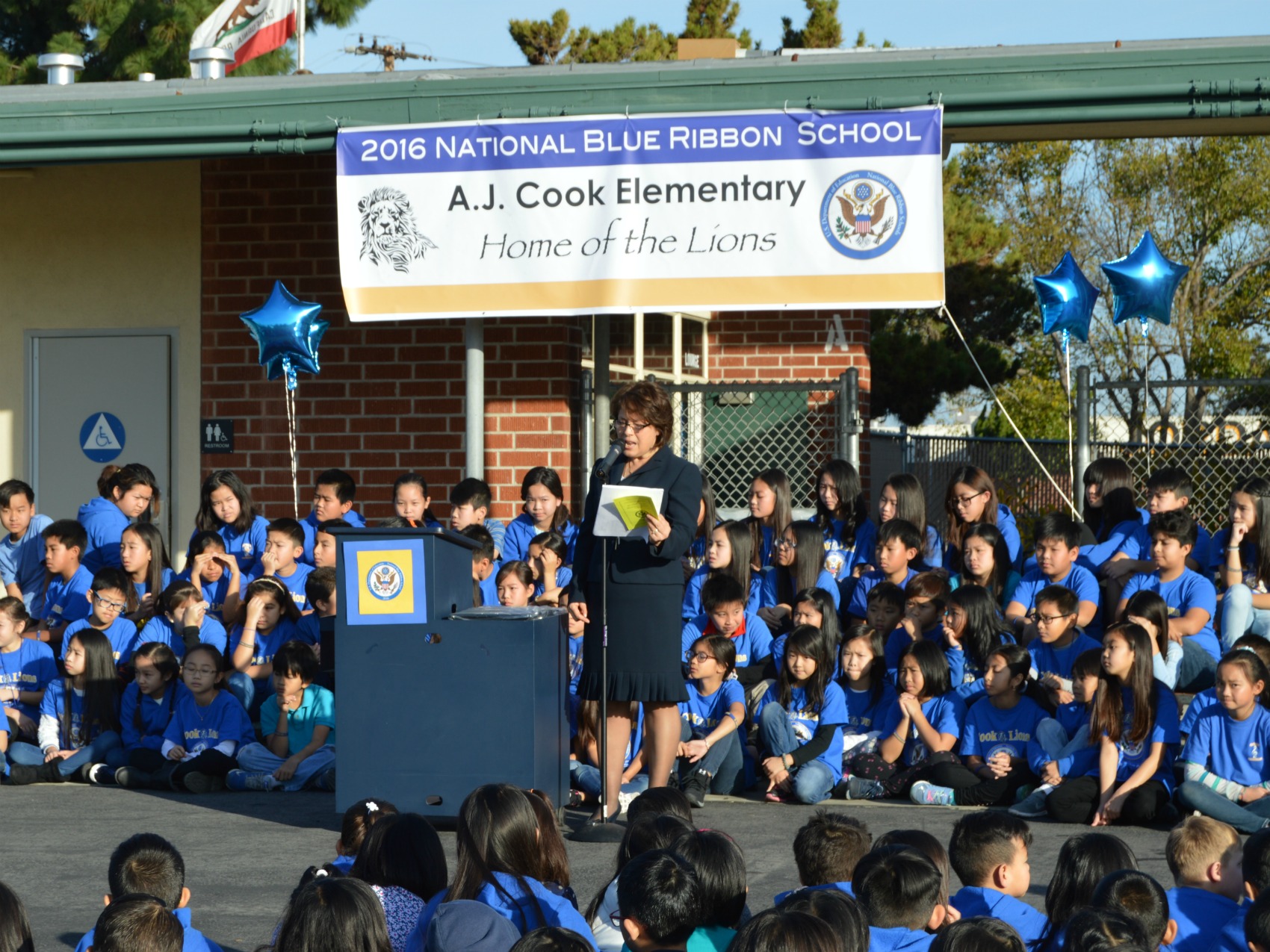 Students from Cook Elementary gathered on the blacktop for a National Blue Ribbon ceremony