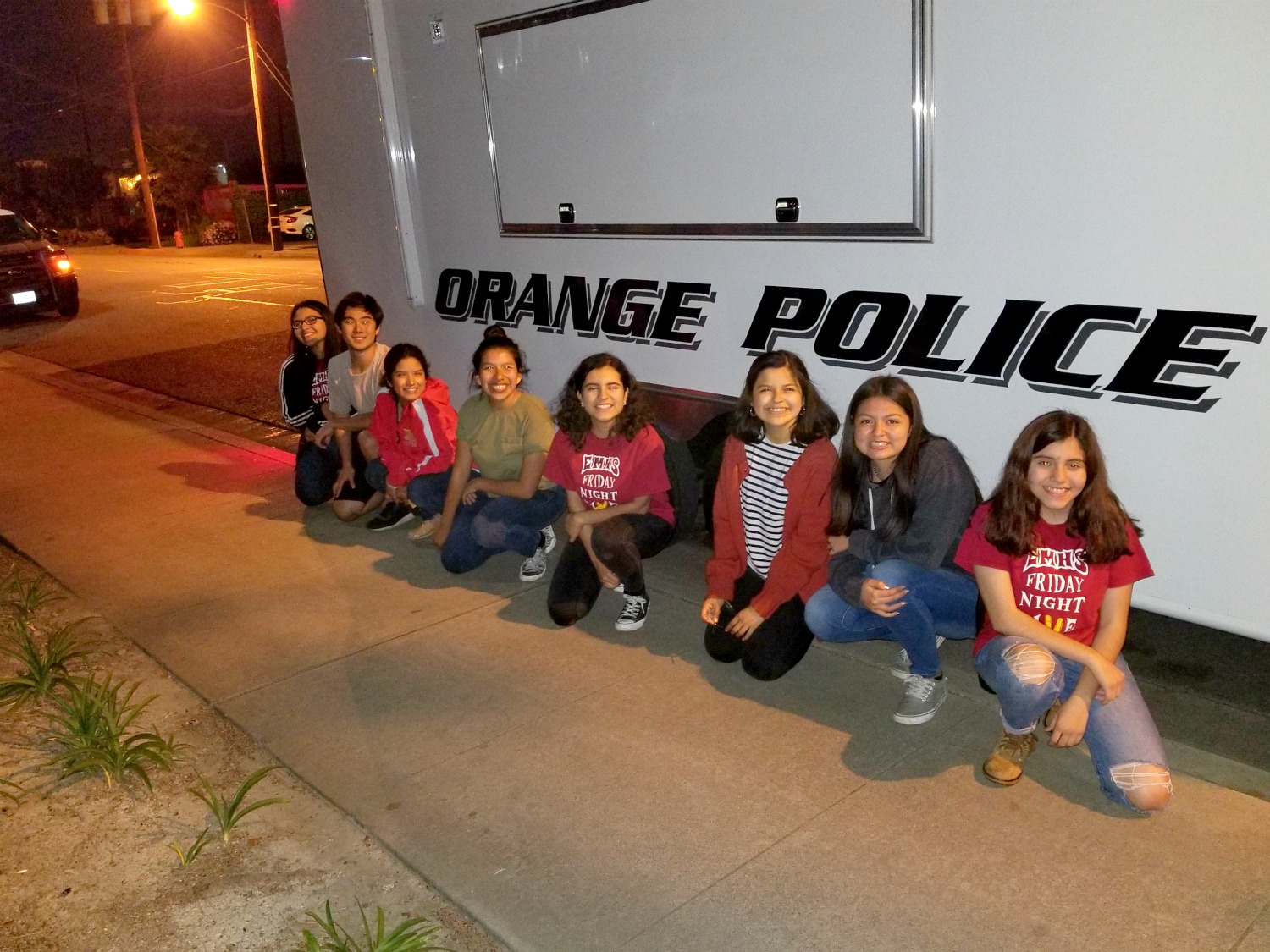 FNL students in front of an Orange Police vehicle