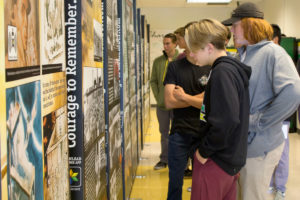 Students inspect "The Courage to Remember" traveling Holocaust exhibit