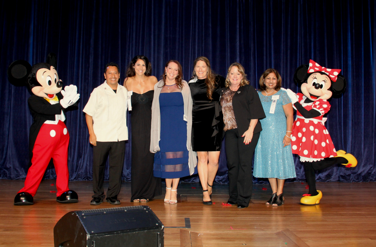 The six Orange County Teachers of the Year finalists with Mickey and Minnie Mouse