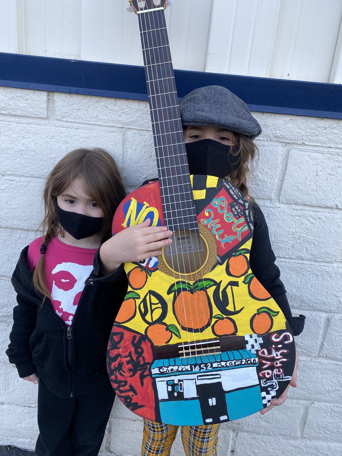 Children with painted guitar