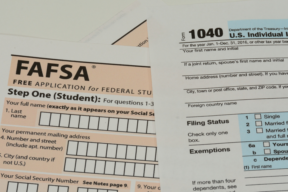 A FAFSA application and 1040 tax form