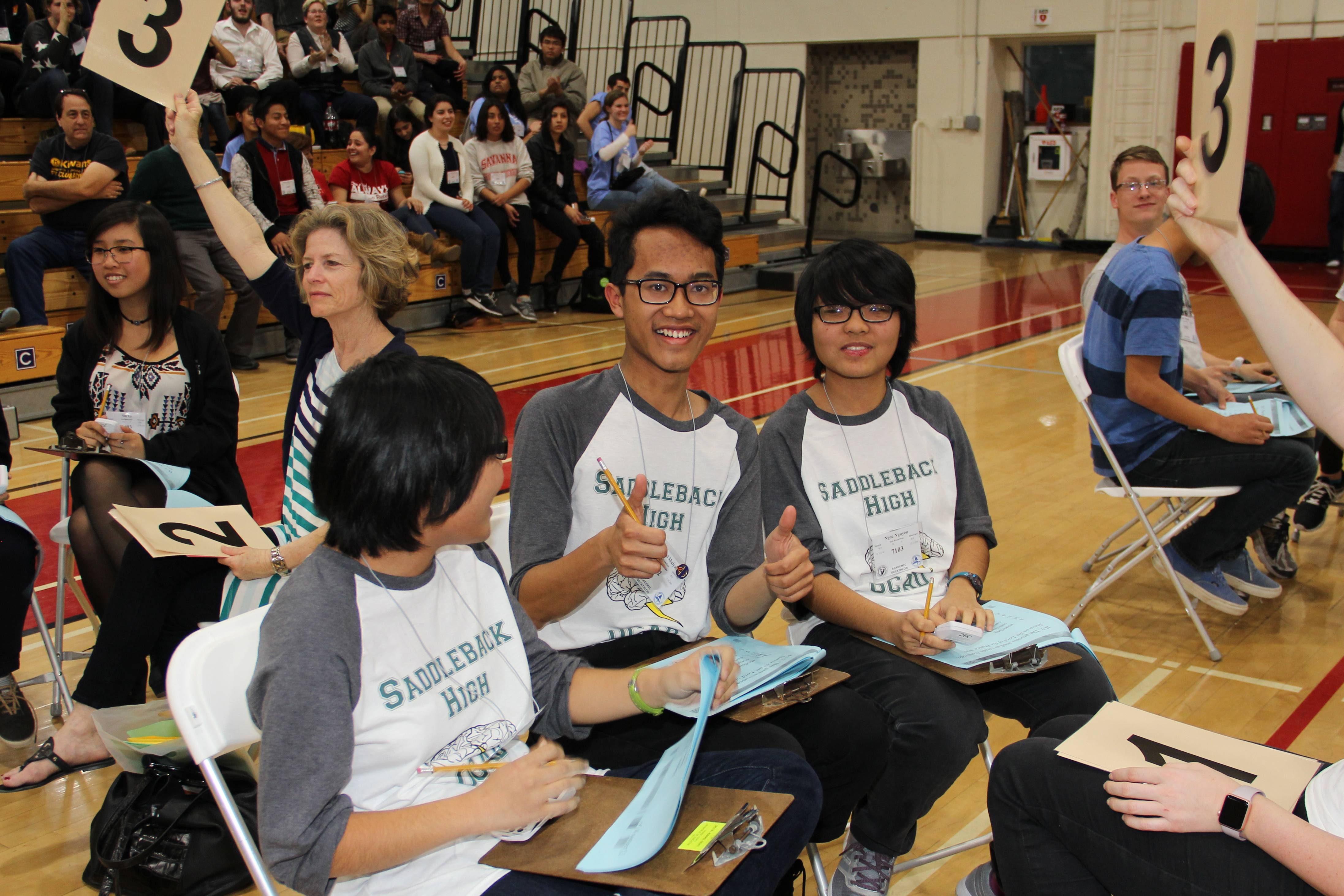 Students smiling at the Orange County Academic Decathlon