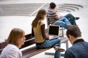 An image of a girl using a laptop