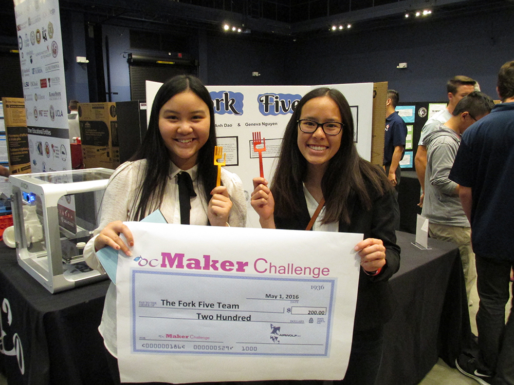 An image of two students who won first place at the ocMaker Challenge