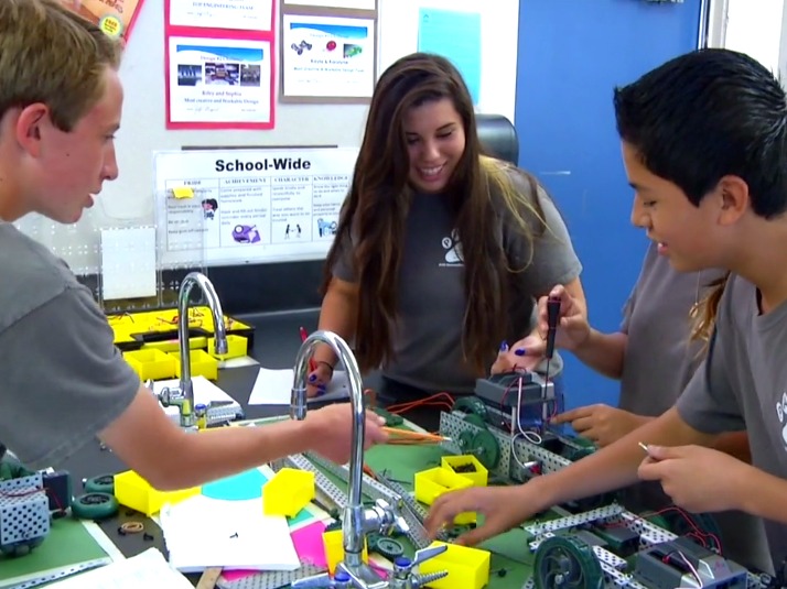 An image of students working on a robotics program in Tustin