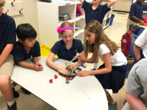 STEM students with launch machine