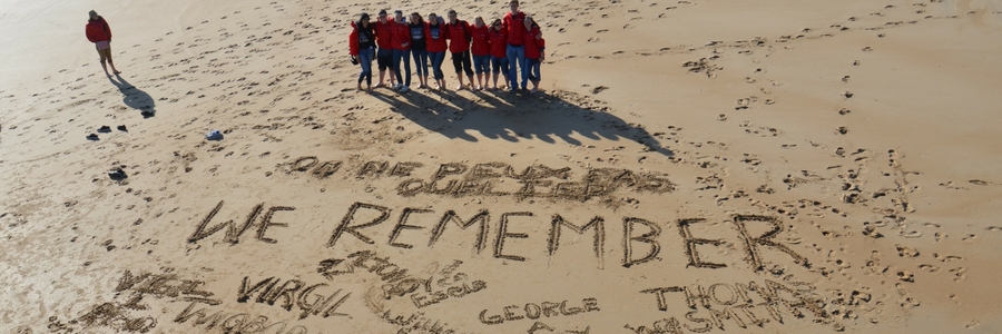 Students on a beach in Normandy, France