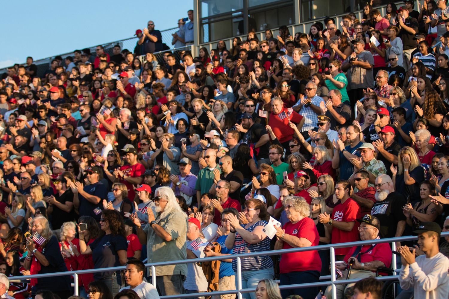 Community members cheer during the dedication ceremony for the Michael A. Monsoor Memorial Stadium