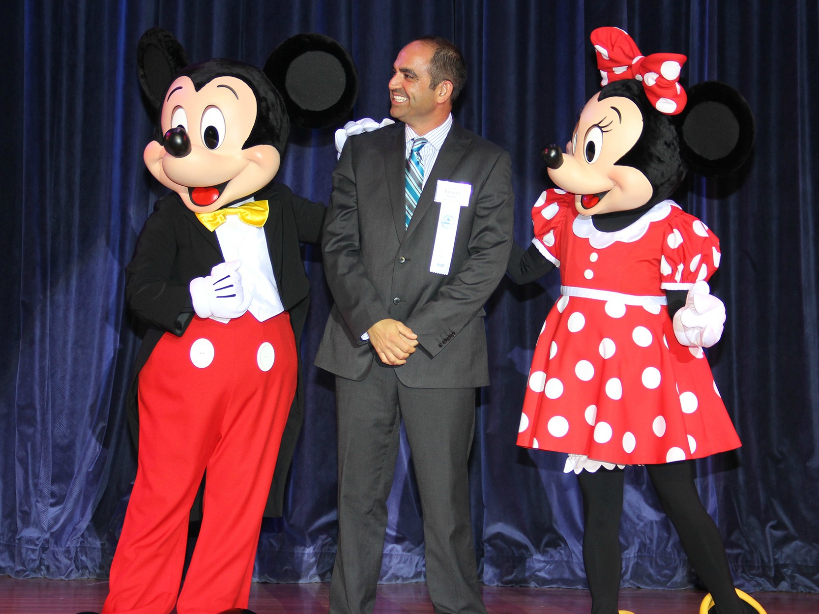 Vincent Saporito stands with Mickey and Minnie Mouse