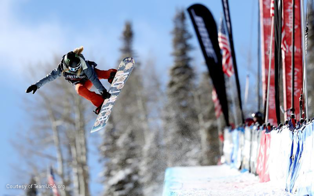 snowboarder Chloe kim performs a jump on the half pipe