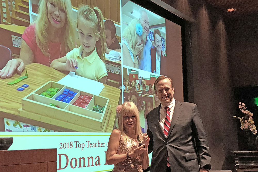 Donna Dowicki is presented with Parenting OC magazine’s “Top Teacher” award by SchoolsFirst Federal Credit Union President and CEO Bill Cheney.