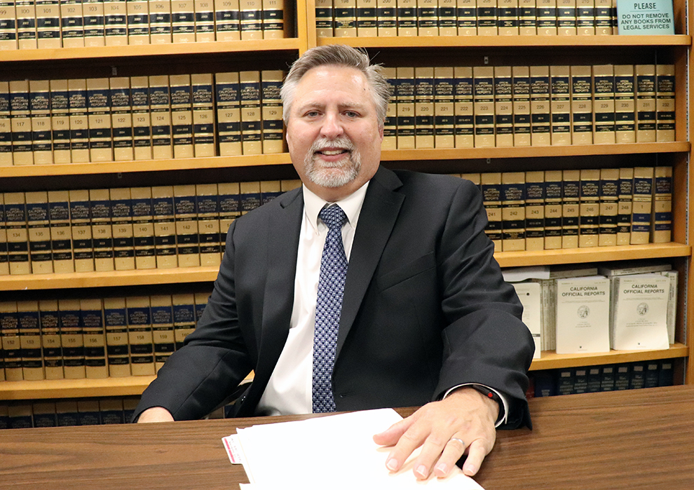 attorney sitting at desk