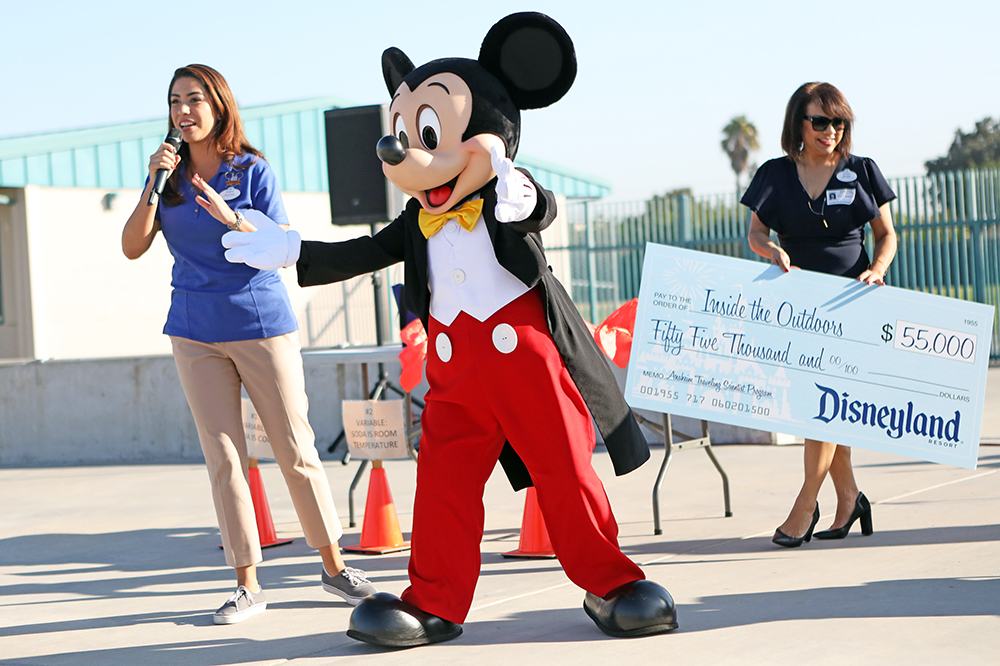 Mickey Mouse greets students