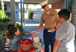 students greet U.S. Marine at school