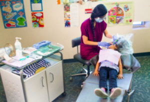 dentist working on a child's mouth