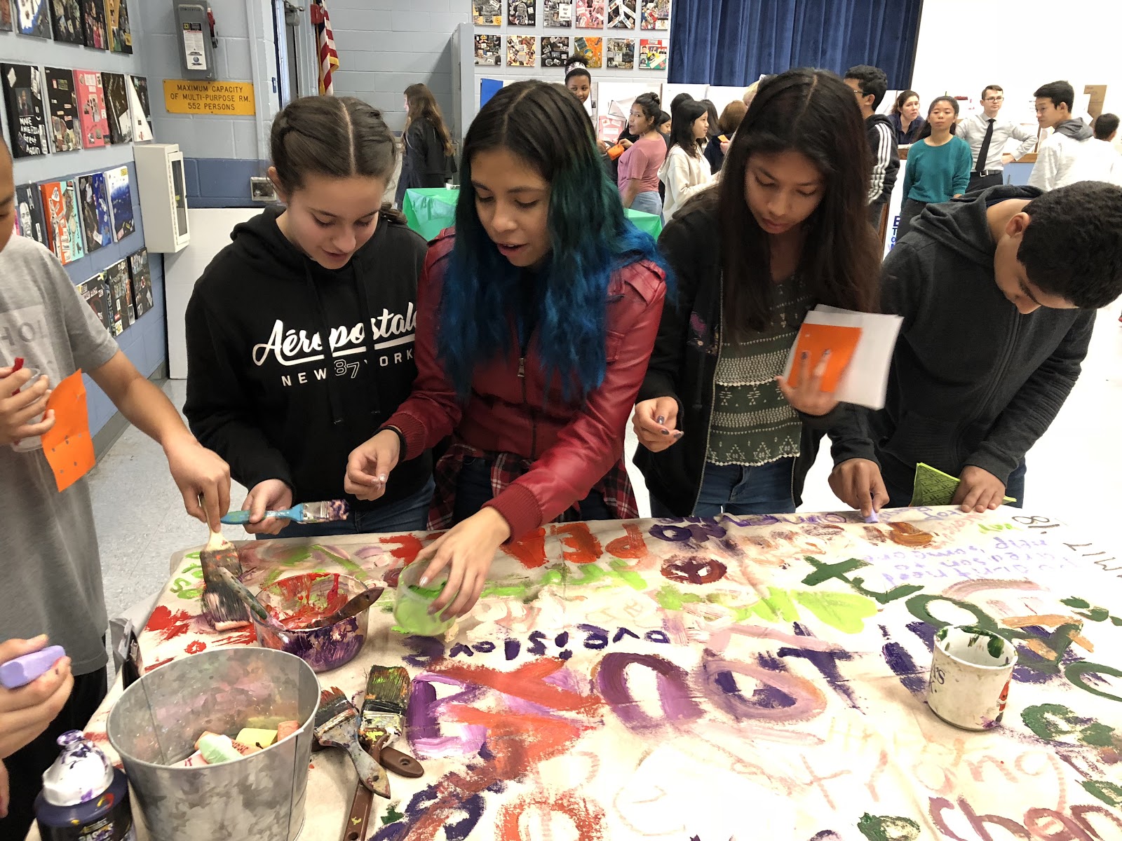 Four students painting