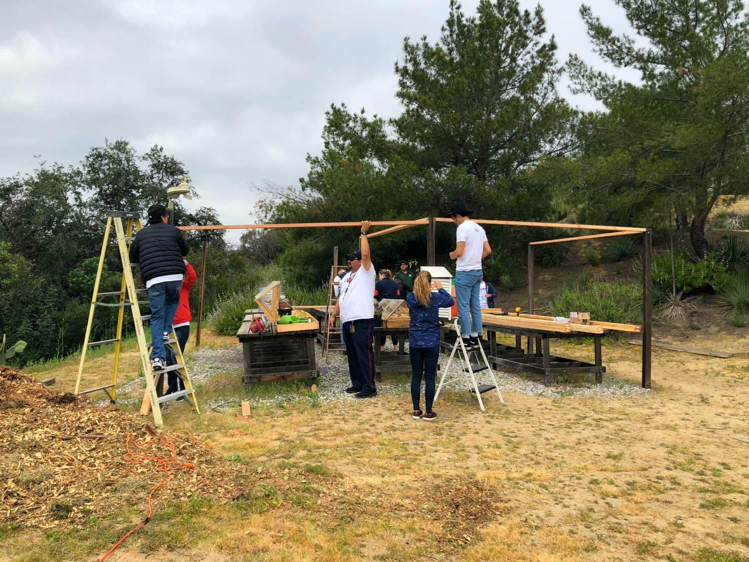 Volunteers building a structure