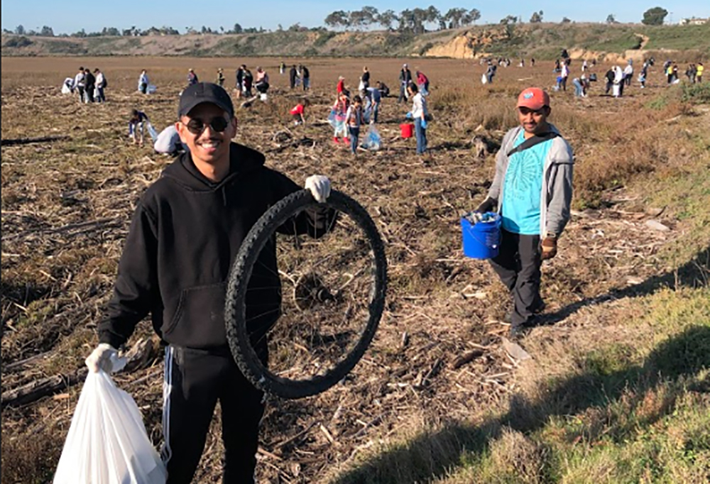 students cleaning up refuse