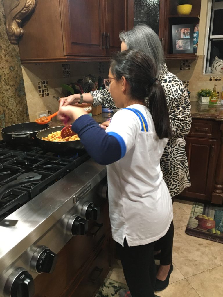 Girl helps her mother cook