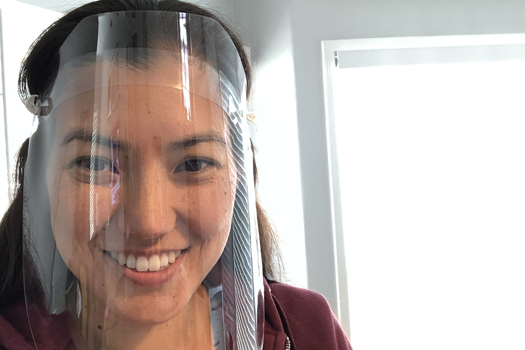 woman demonstrates face shield