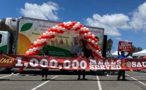 balloons and a sign that reads, "1,000,000 meals served"