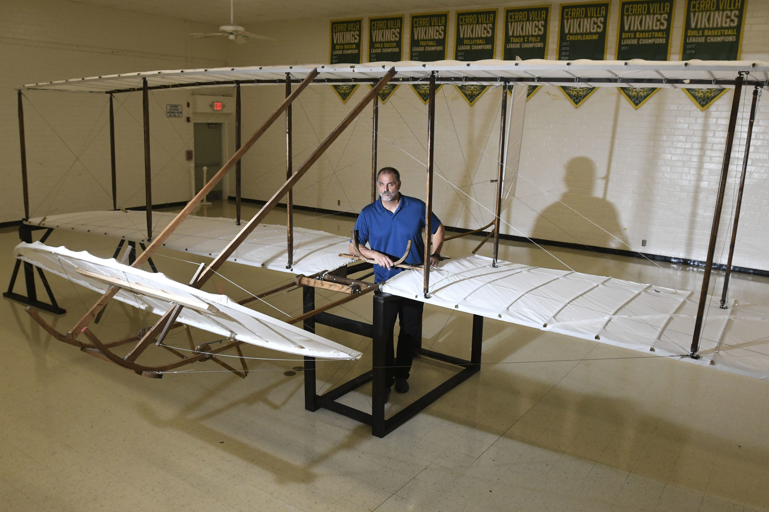 Teacher with Wright brothers glider replica