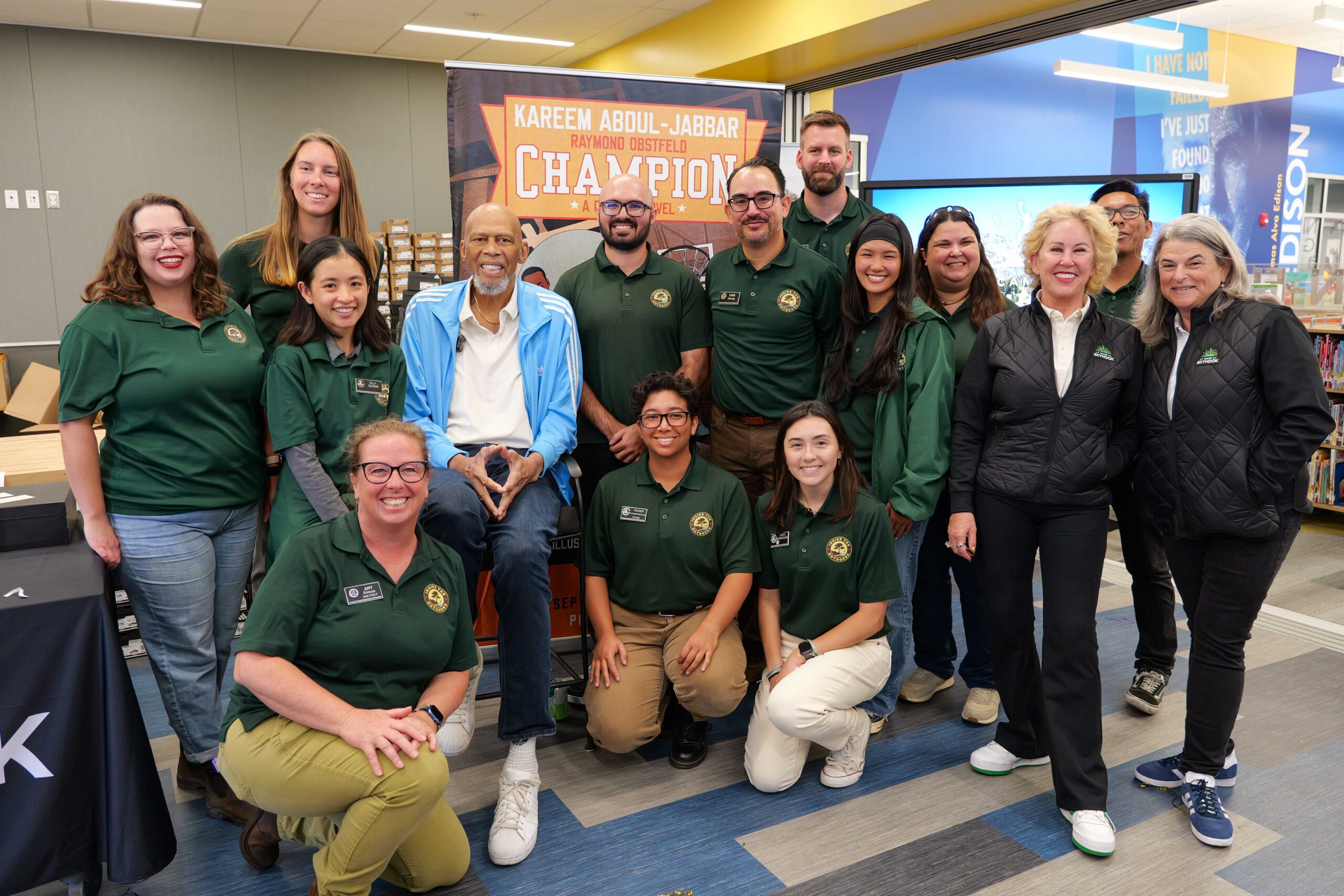 Kareem Abdul-Jabbar gathers with team members from Inside the Outdoors and the Skyhook Foundation at Thomas Edison Elementary School.