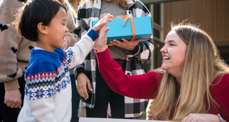 Teacher and student high-fiving