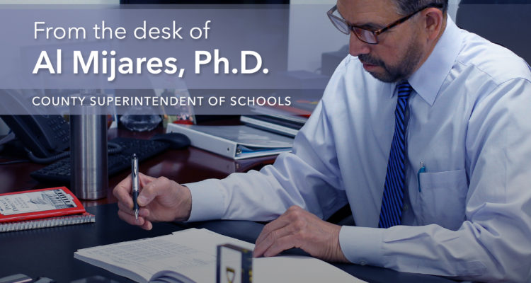 Al Mijares at his desk