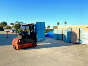 Fork lift carries pallet