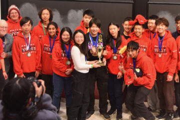 Members of the Troy High School Science Olympiad team pose with their first-place trophy at the 2026 MIT Science Olympiad Invitational.