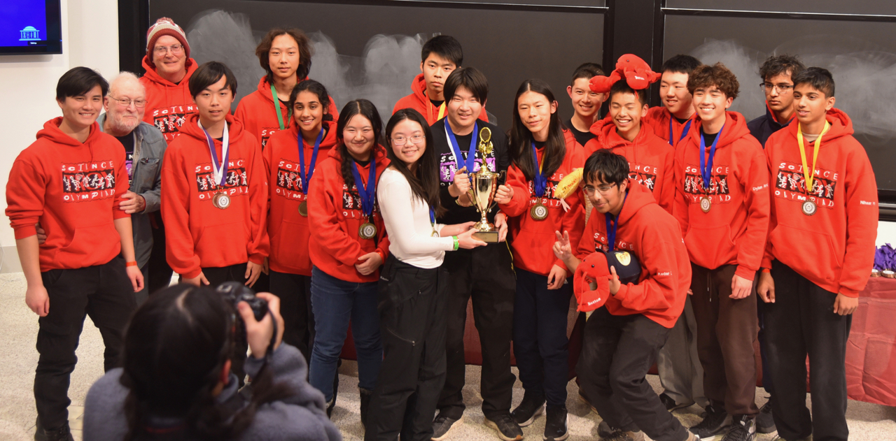 Members of the Troy High School Science Olympiad team pose with their first-place trophy at the 2026 MIT Science Olympiad Invitational.