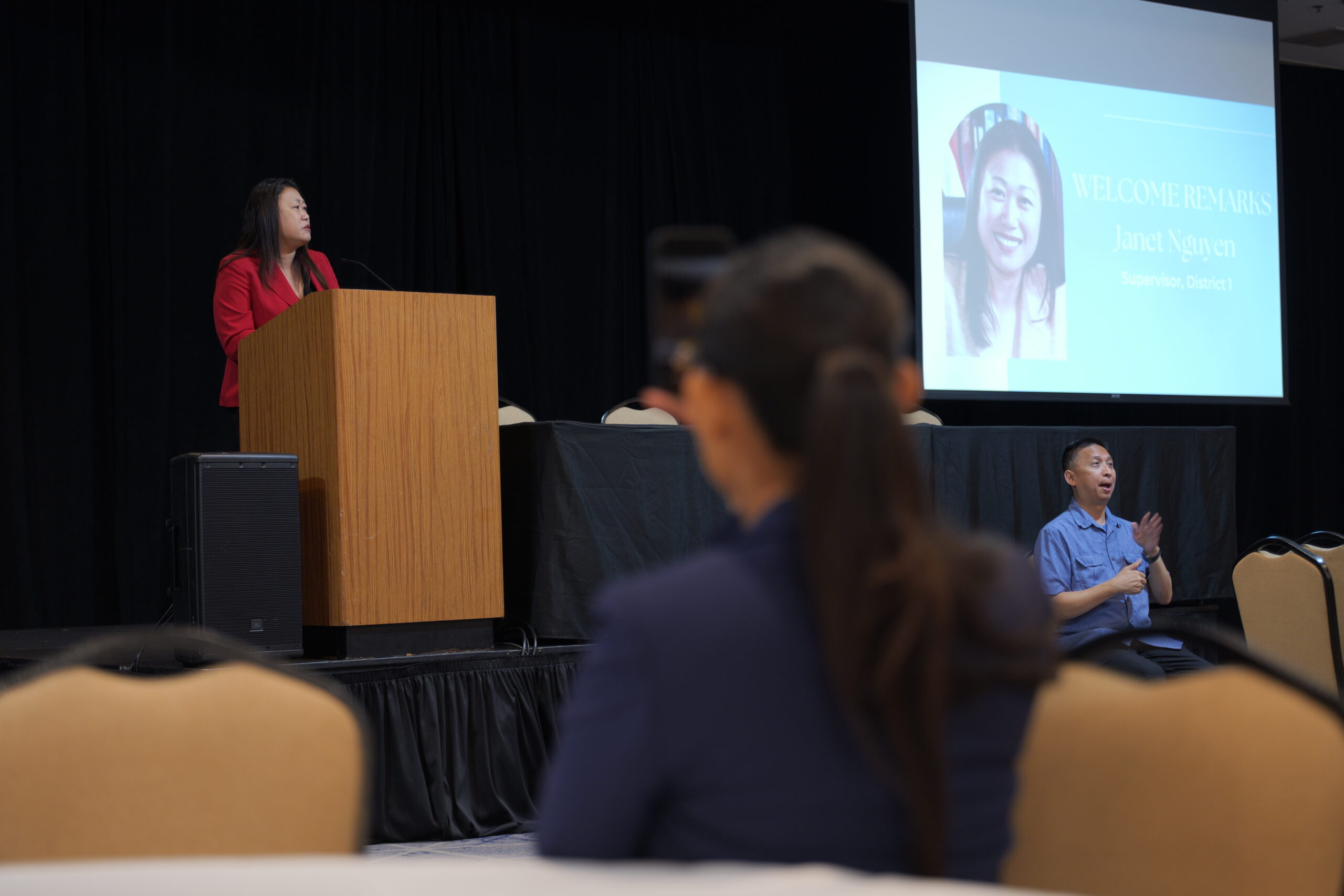 Orange County Supervisor Janet Nguyen offers welcome remarks and shares her family’s story and career journey at the start of the conference.