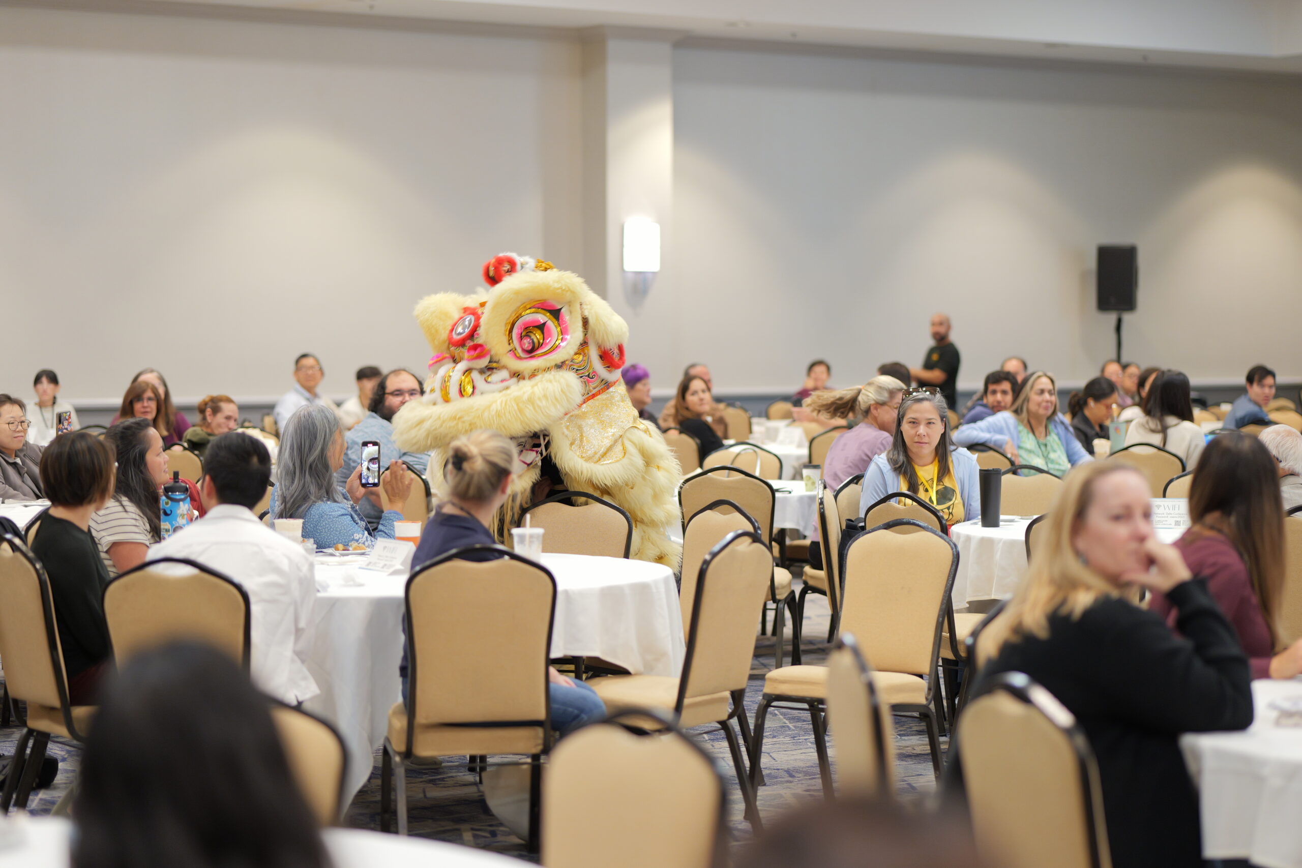 A lion dance performance makes its way through the grand ballroom Saturday.