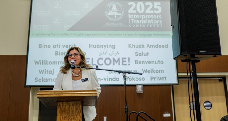 Natalia Abarca, coordinator of OCDE’s Language Services unit, welcomes guests to the 2025 Interpreters and Translators Conference.
