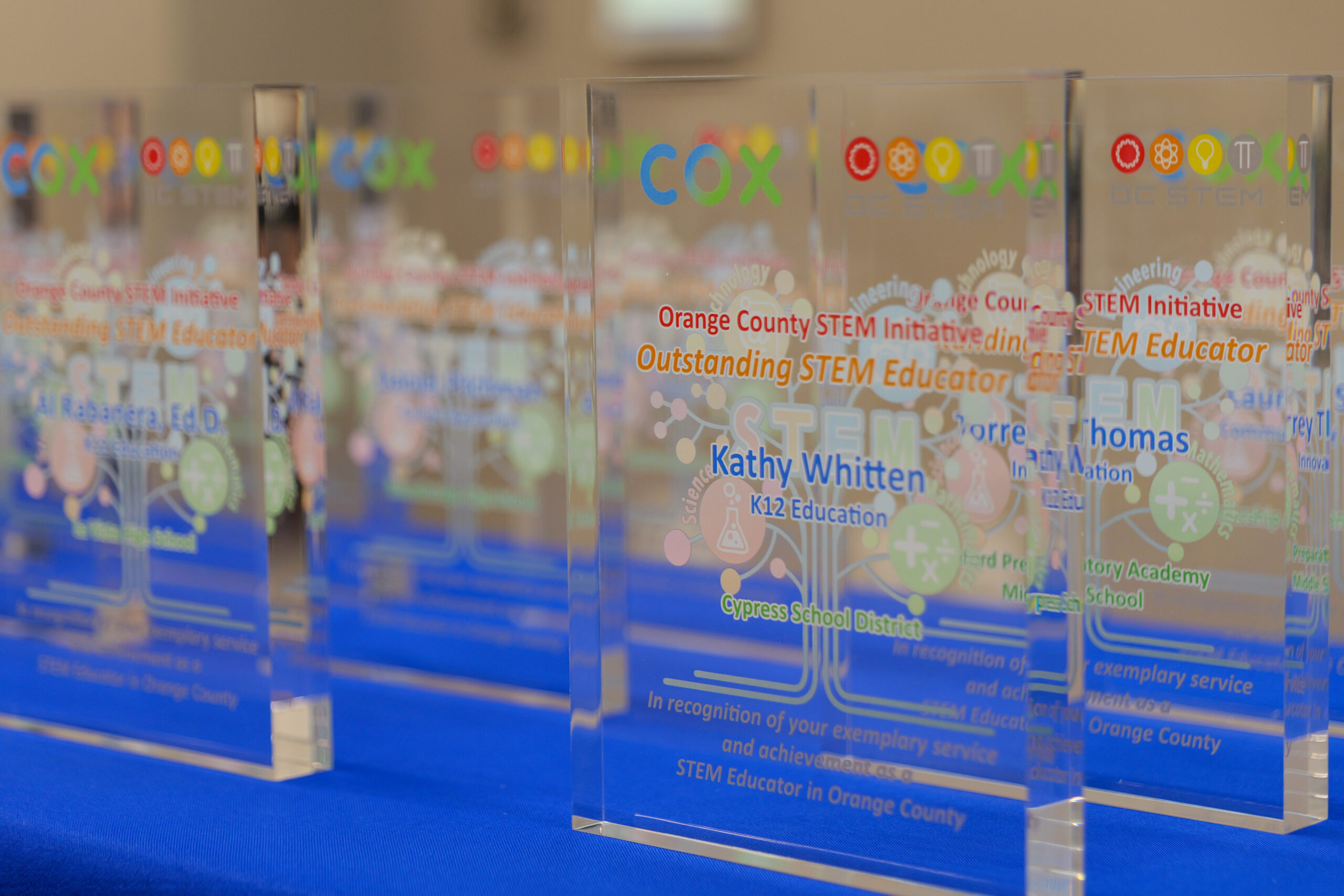 Awards presented to this year’s honorees are displayed before the start of the 2025 Outstanding STEM Educator Awards ceremony at the Orange County Department of Education’s Conference Center in Costa Mesa.