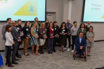 Award recipients, representatives from Cox Communications, local elected officials’ offices, Dr. Bean and OCDE staff gather for a group photo following the ceremony.