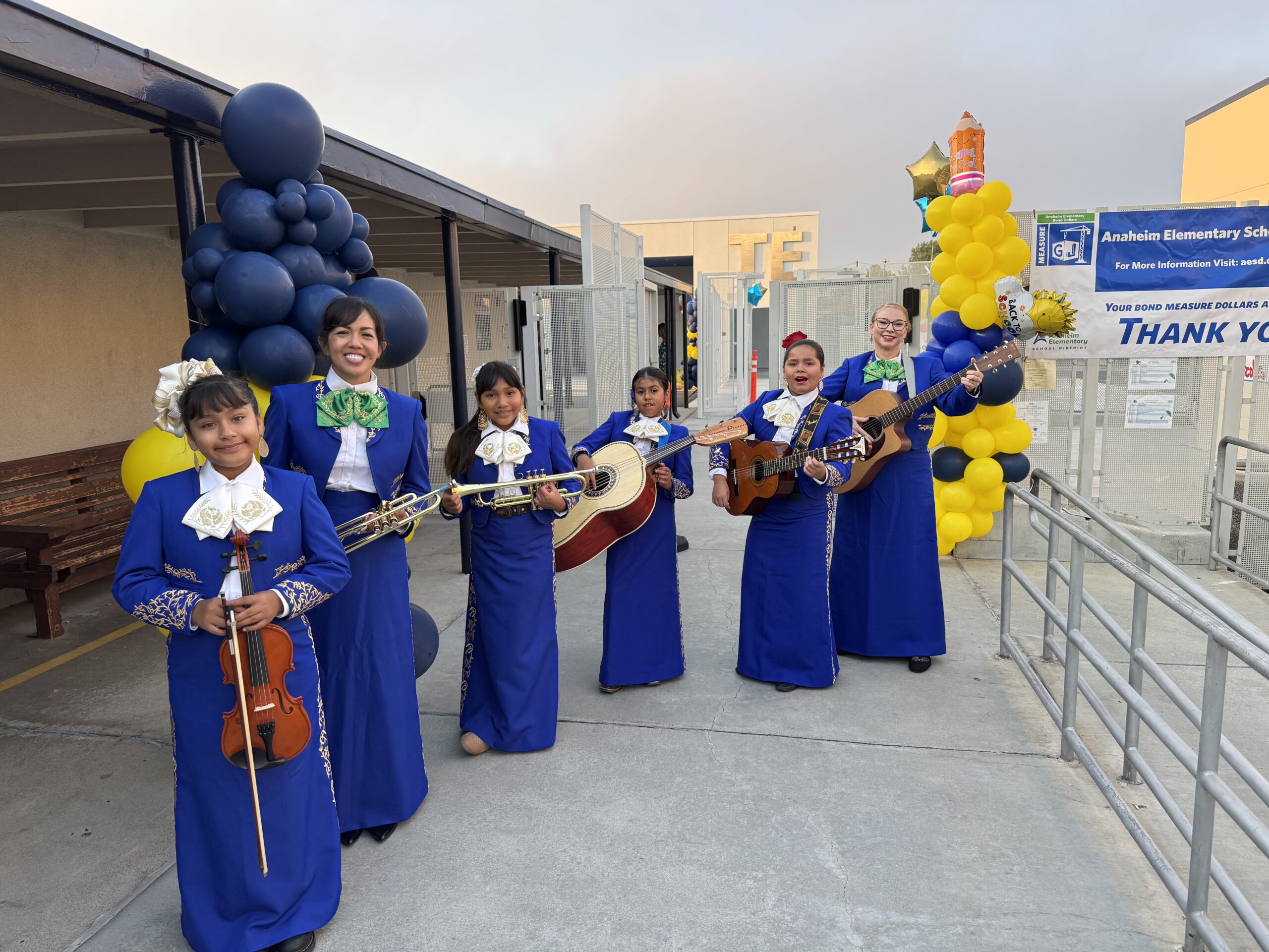 Mariachi members prepare to welcome students and staff on the first day of school at Thomas Edison Elementary in Anaheim. Pictured from left are student Kiara Ramon, music teacher Grace Kwon, student Rita Polo, student Lupe Estrada, student Victoria Limones and music teacher Christina Flynn.