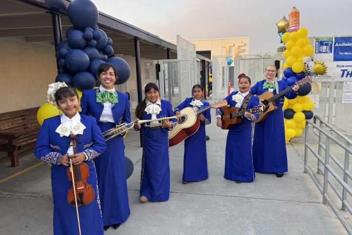 Mariachi members prepare to welcome students and staff on the first day of school at Thomas Edison Elementary in Anaheim. Pictured from left are student Kiara Ramon, music teacher Grace Kwon, student Rita Polo, student Lupe Estrada, student Victoria Limones and music teacher Christina Flynn.