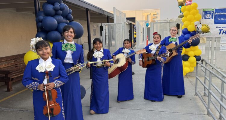 Mariachi members prepare to welcome students and staff on the first day of school at Thomas Edison Elementary in Anaheim. Pictured from left are student Kiara Ramon, music teacher Grace Kwon, student Rita Polo, student Lupe Estrada, student Victoria Limones and music teacher Christina Flynn.