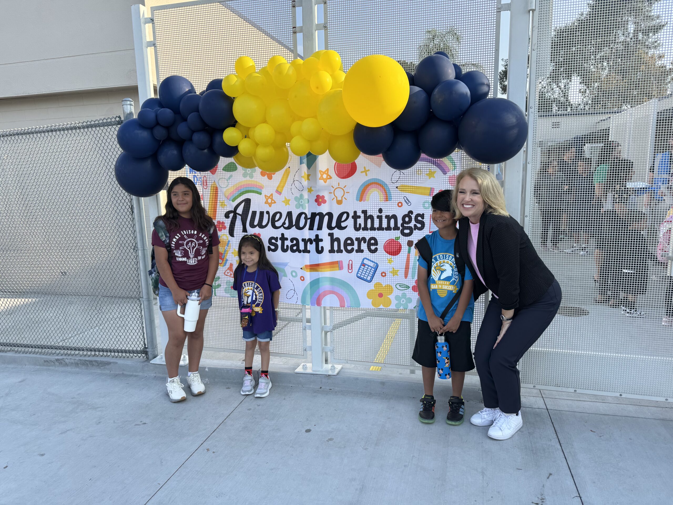 Principal Suzanne Nichols poses with Hope, Amelia and Ronnie Acosta on the first day of school, Aug. 6, at Thomas Edison Elementary in Anaheim.