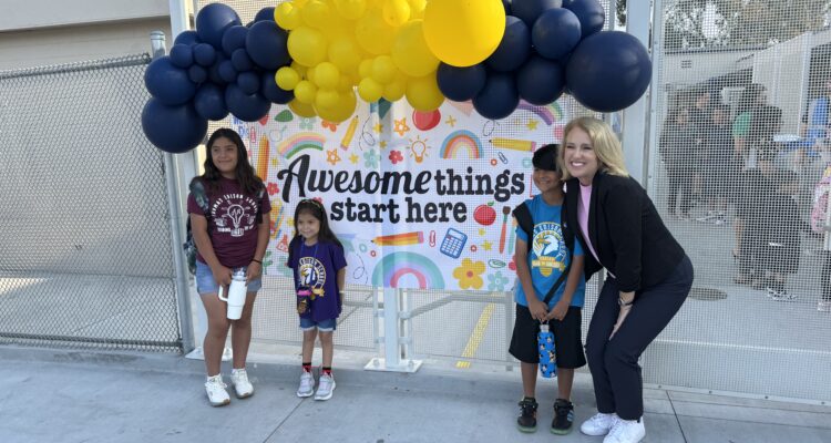 Principal Suzanne Nichols poses with Hope, Amelia and Ronnie Acosta on the first day of school, Aug. 6, at Thomas Edison Elementary in Anaheim.
