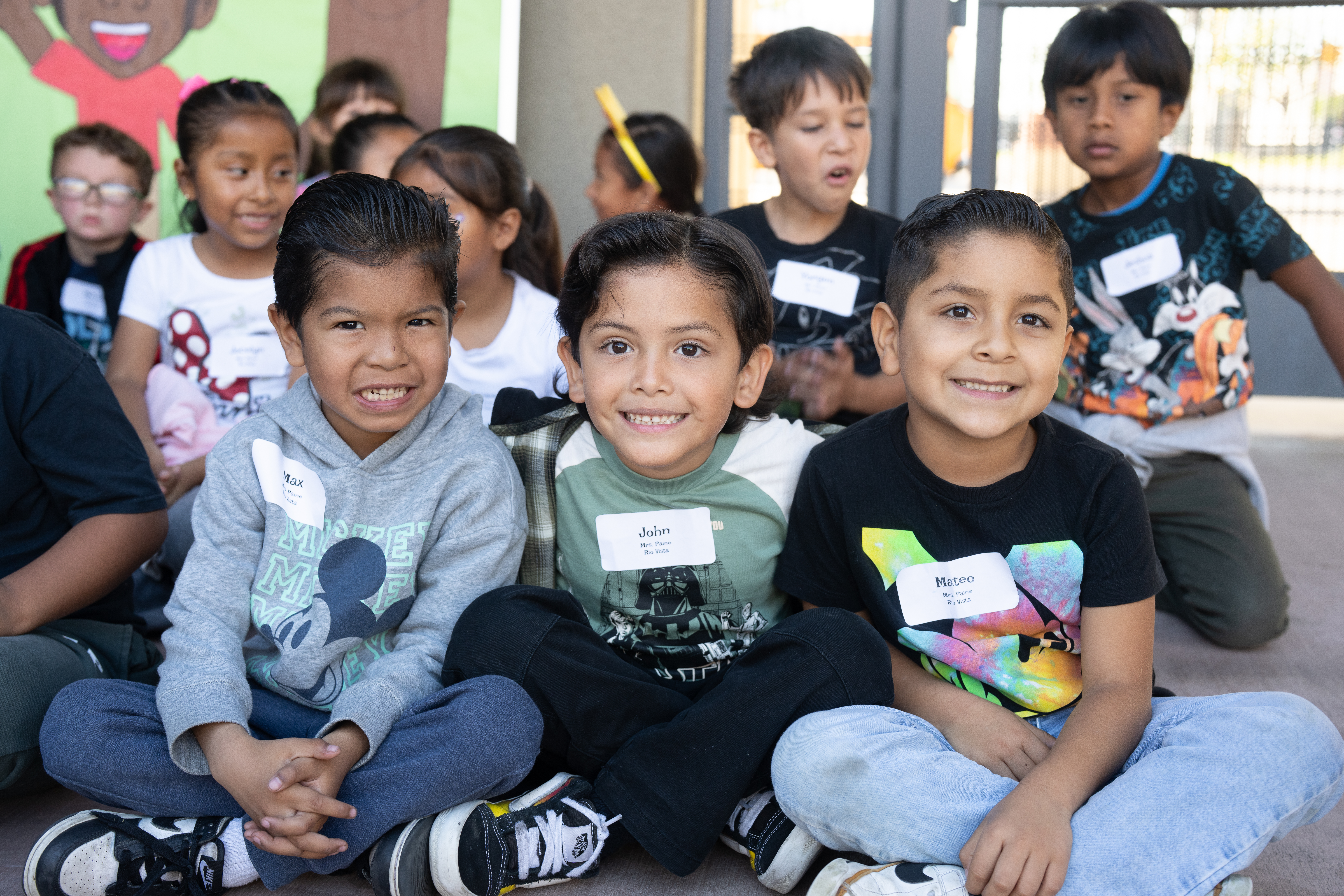 Elementary students Max, John and Mateo pose for a photo.