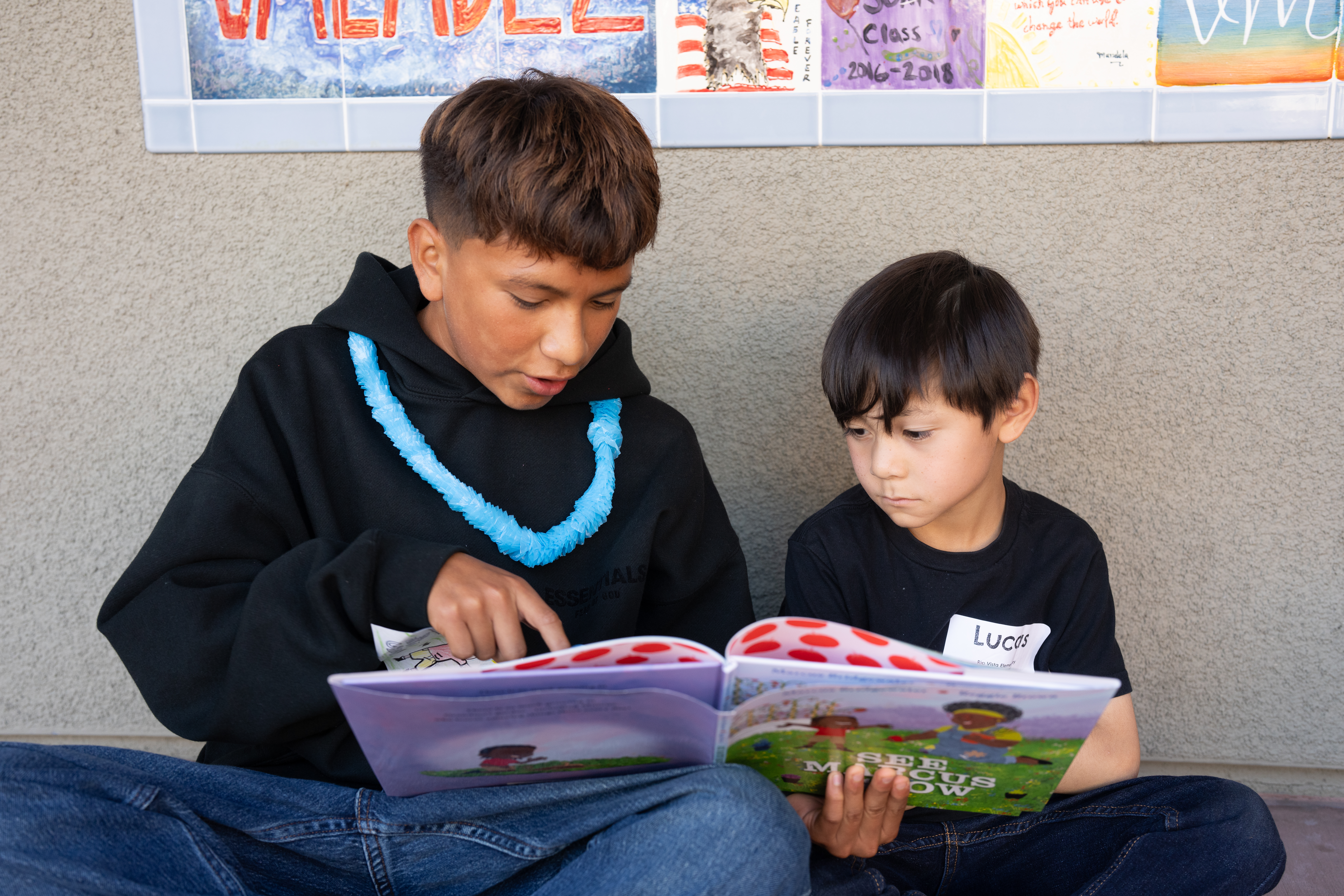 New buddies read “See Marcus Grow” by Marcus Bridgewater.