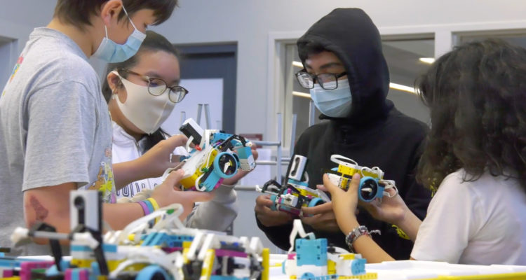 Students with robotics