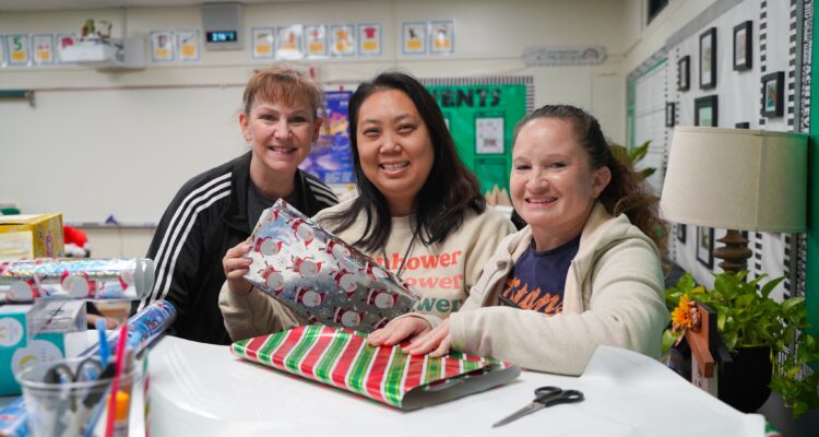 Teachers wrap gifts for their students