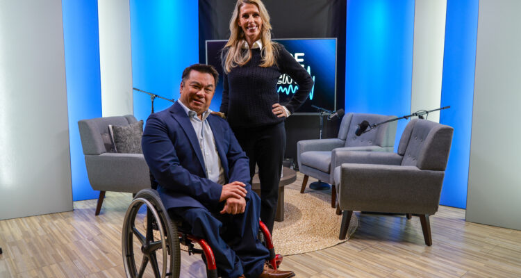 Dr. Stefan Bean and Lainie Rowell on the FutureCurrent podcast set, with microphones and chairs arranged for a recorded conversation.