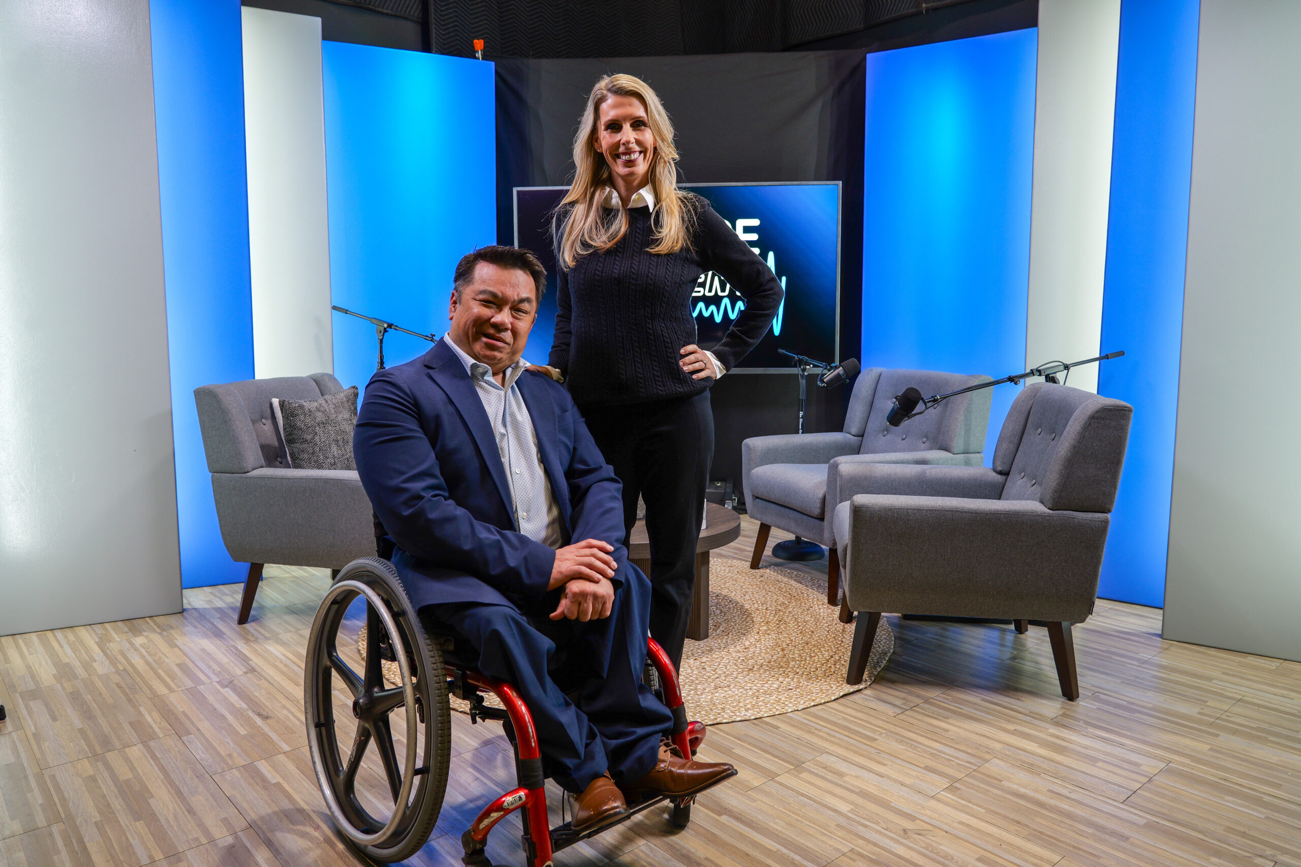 Dr. Stefan Bean and Lainie Rowell on the FutureCurrent podcast set, with microphones and chairs arranged for a recorded conversation.